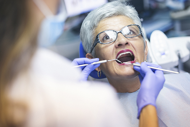 Senior female patient at dentist office